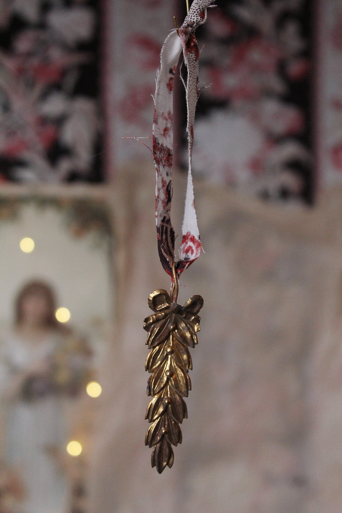 Old French Pressed Brass Leaf Decoration With Printed Cotton Hanger