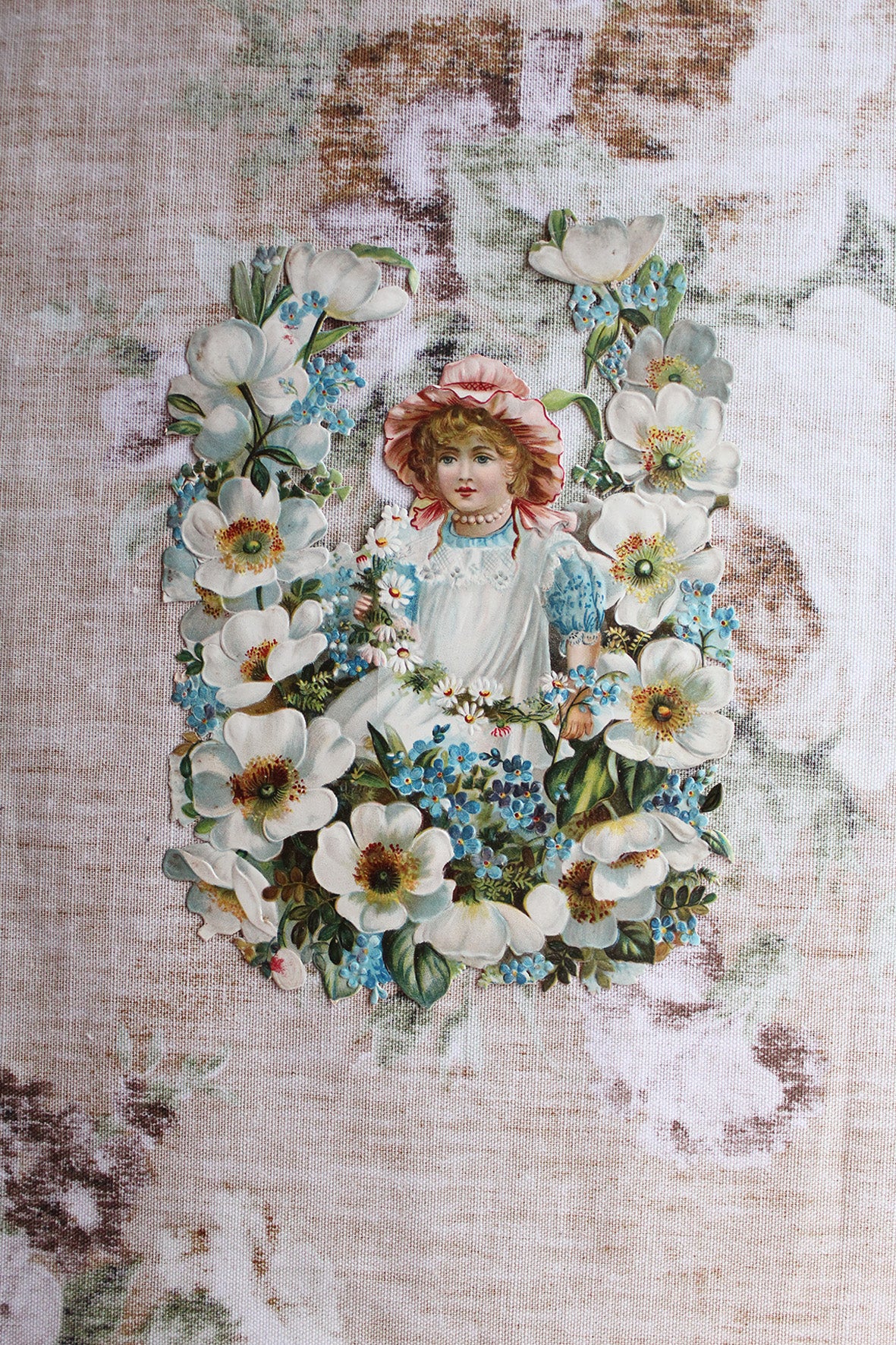 Large Victorian Embossed Die Cut - Girl in A Field of Roses and Forget-me-Nots