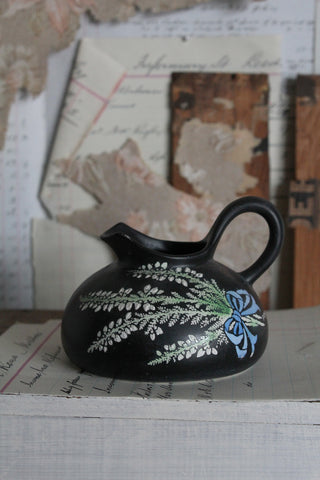 An Old Shelley Black Jug Decorate with A Hand Painted Sprig of Heather
