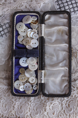 Old Worn Box Filled With Mother of Pearl Buttons