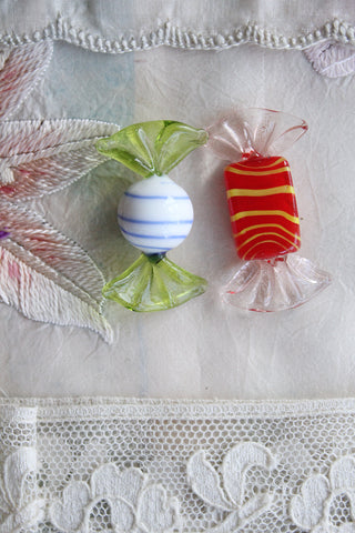 Two vintage hand made glass beads.